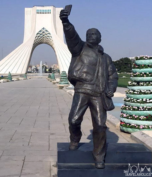 "Selfie" statue at Tehran Azadi square, with Azadi Tower, photo by Thomas Shubbuck